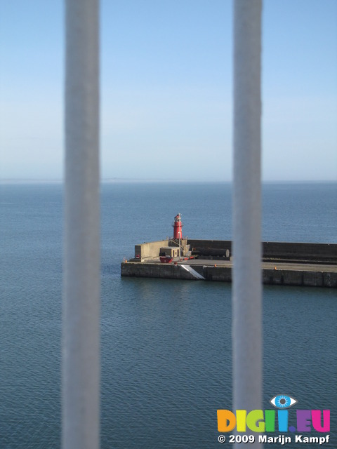 SX03000 Lighthouse of Rosslare harbour through ferry railing